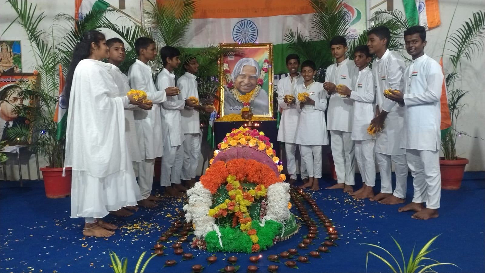 VMF students offering flowers before a portrait of Dr. A.P.J. Abdul Kalam at Nithin Bhavan